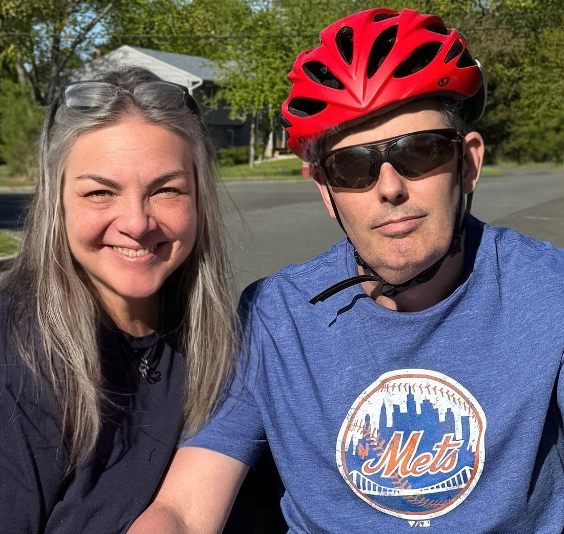 Jimmy Appio riding his Lectric XP Trike after stroke recovery, smiling confidently with Shannon.